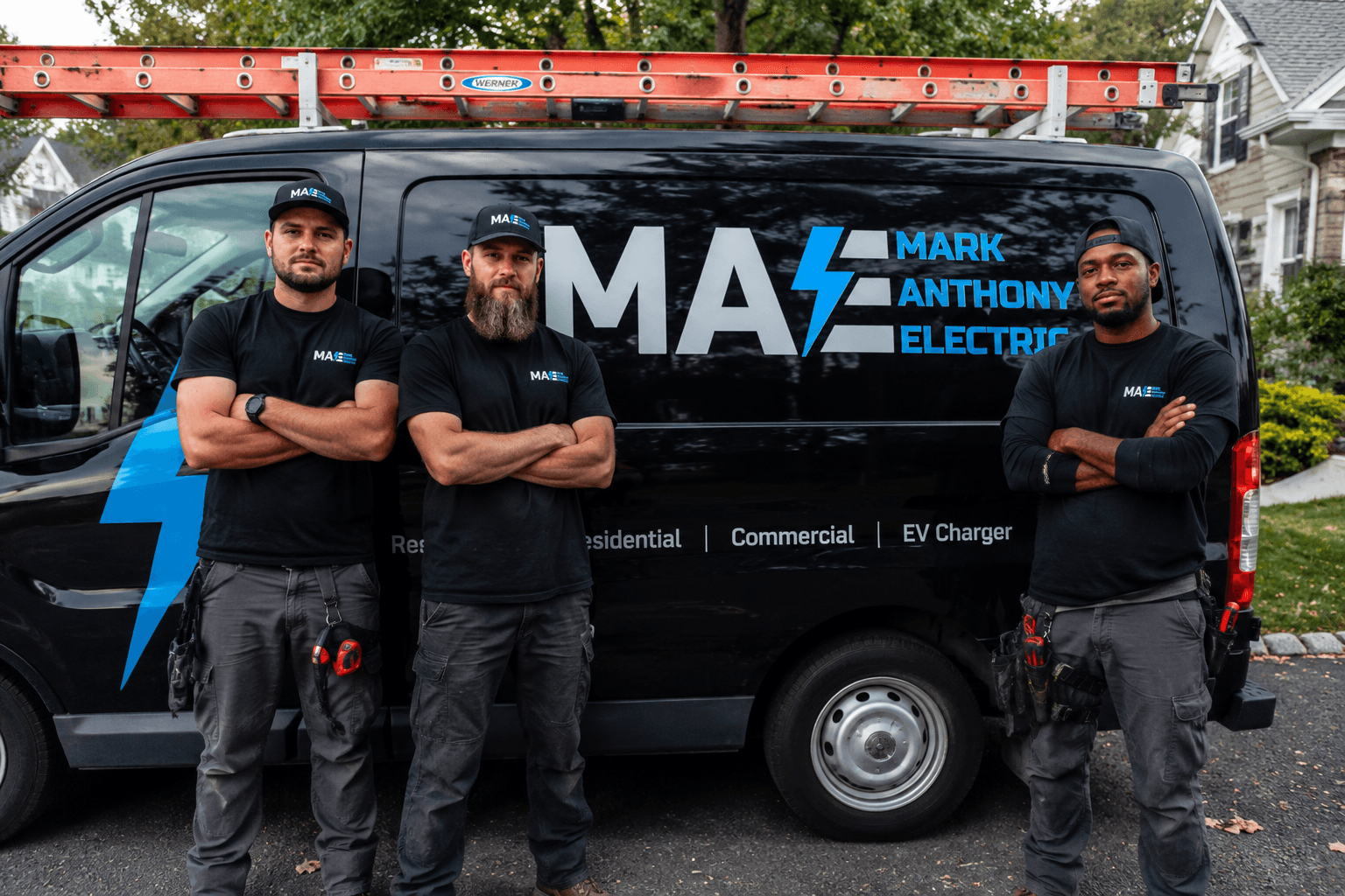 The Mark Anthony Electric team in front of a company van